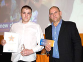 Ian Munro, Chief Executive, presenting Simon Blomely with his award.