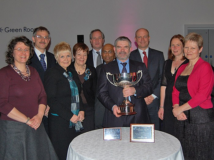 The Gilbert Leferve Memorial Trophy with members of staff from Tameside College