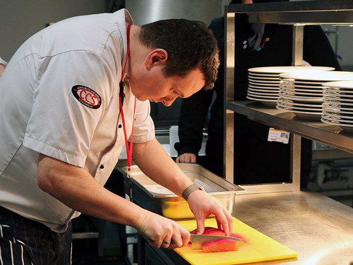 Andrew working in the college restaurant