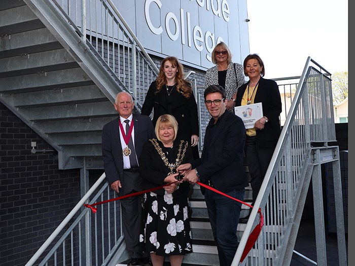 Mayor Andy Burnham with VIPs cutting the opening ribbon