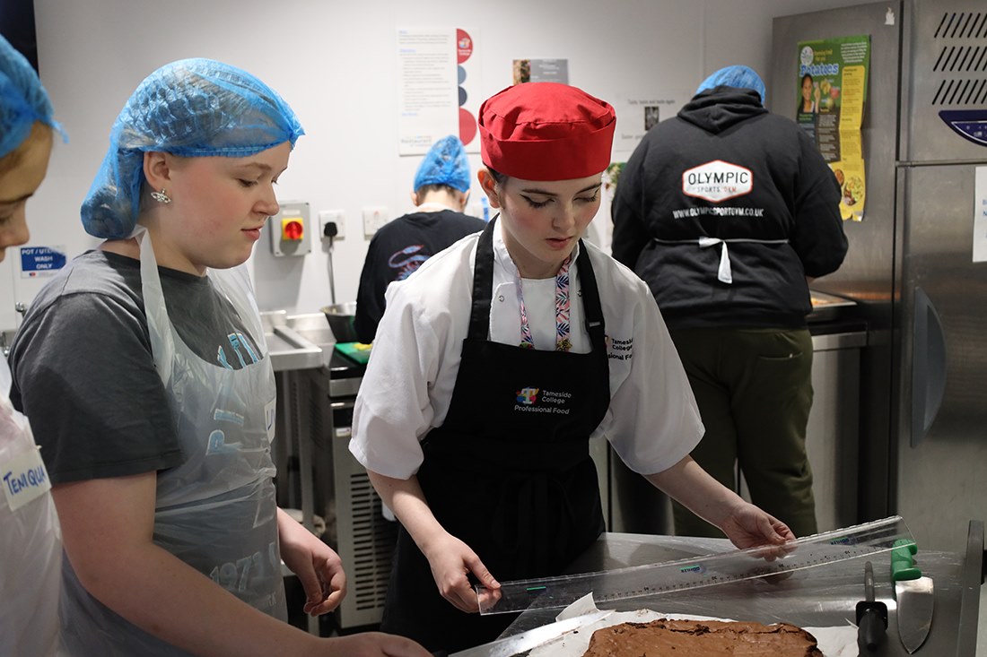 Pupils working with students from the college