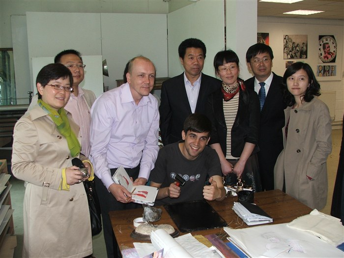 Andy Cheers with Chinese colleagues viewing Art work