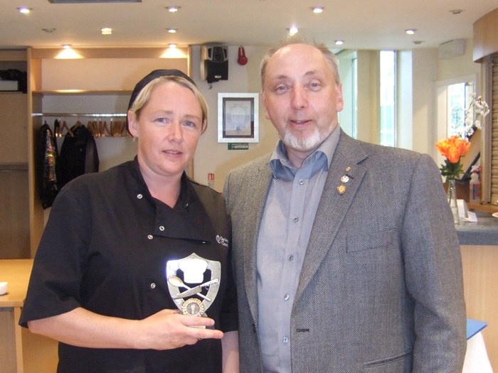 Peter Cooke presenting Sandra Fairclough with the winners Trophy.