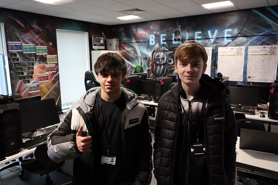 Two students from the team in the college Esports room