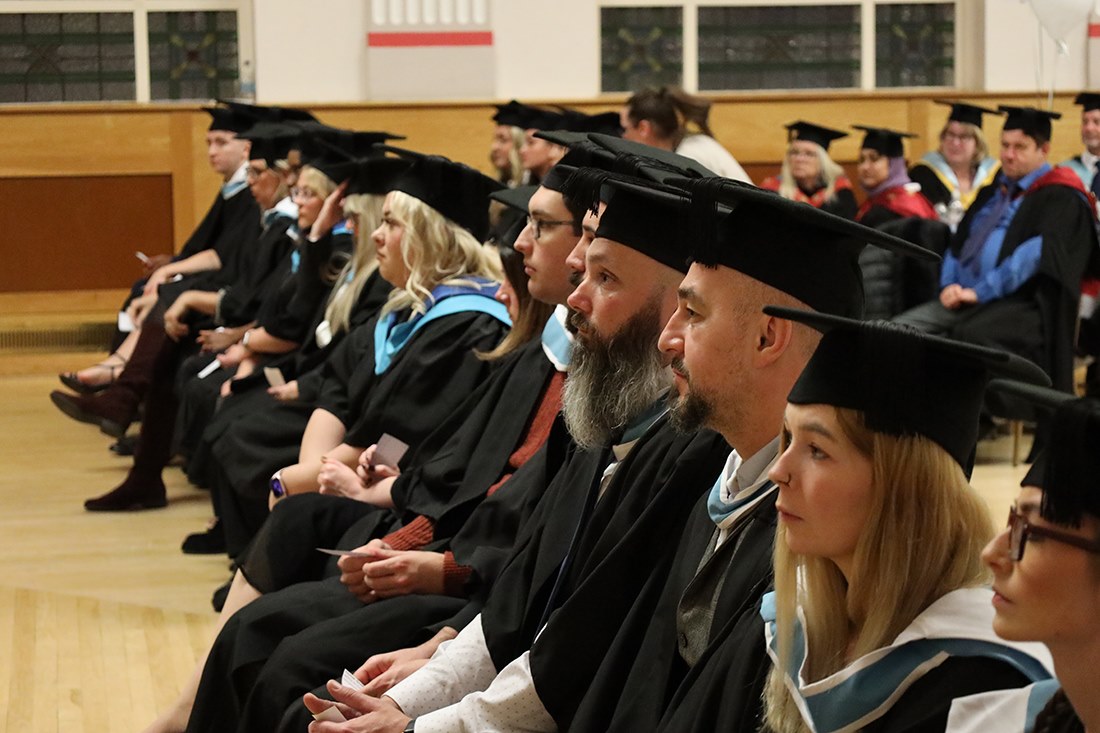 Students listen to speeches by VIPs