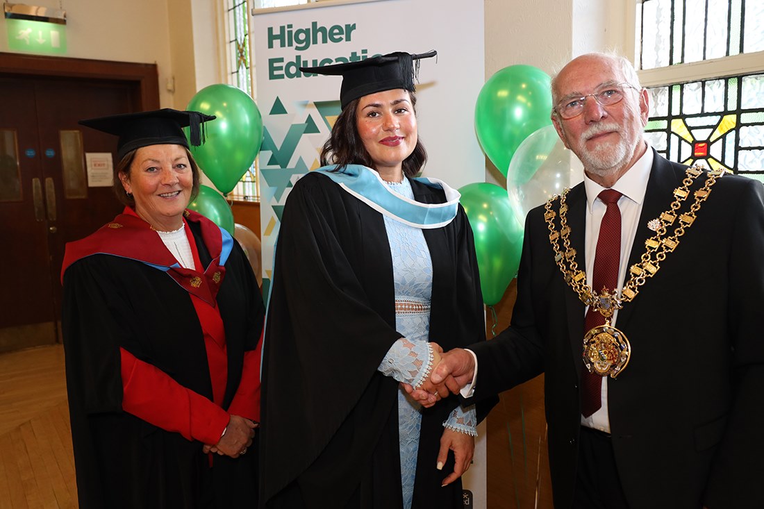 Graduate with principal Jackie Moores and the Mayor
