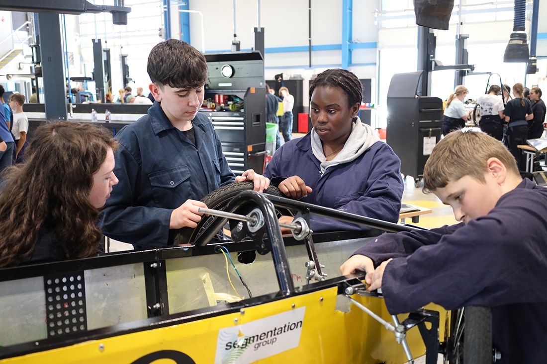 Students work to build their cars