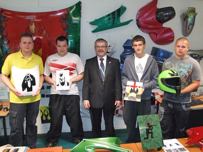 Principal Peter Ryder with some of the entrants to the competitions and their work.