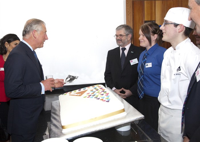 Prince Charles greeting Peter Ryder and students.