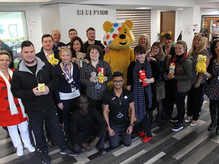 Staff and students with Pudsey Bear