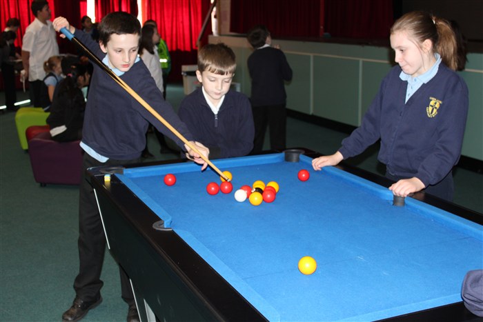 Pupils enjoying playing pool