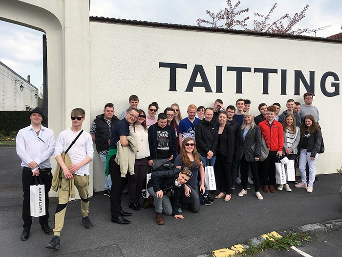 Students outside Taittinger champagne vaults