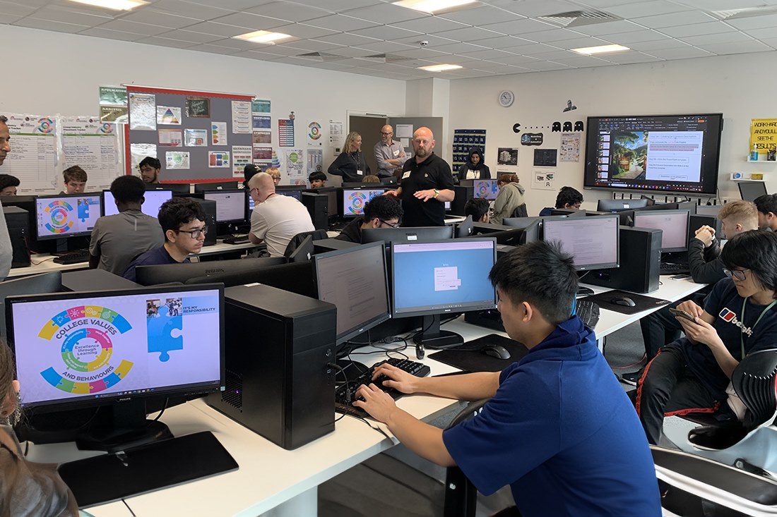 Students working with Microsoft staff